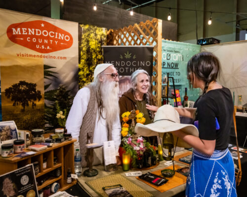 cannabis world news competitions couple at booth