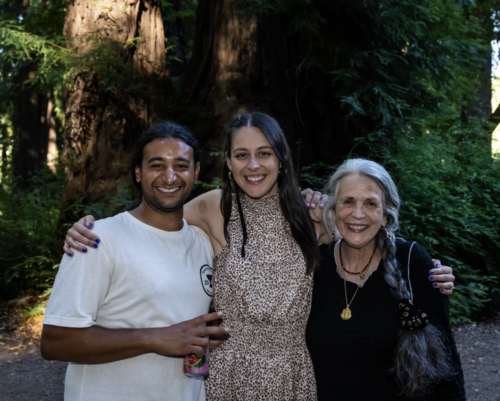 cannabis world news a man and two women hugging and sniling