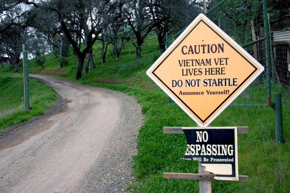 cannabis world news .image of road and sign that says Caution Vietnam Vet Lives Here and caution