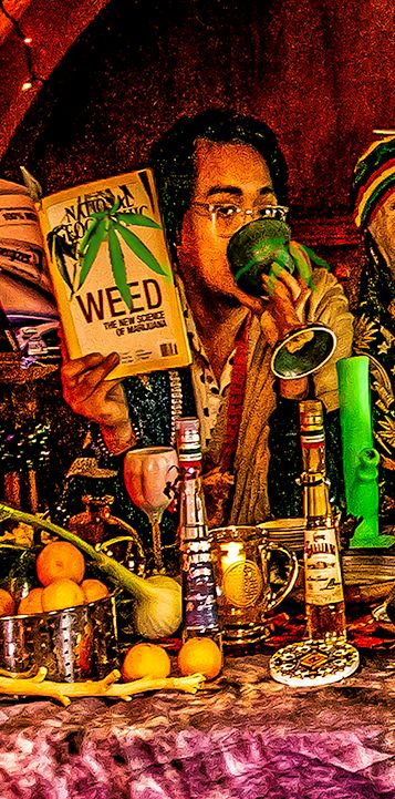 cannabis world news legalization image of man holding Weed book